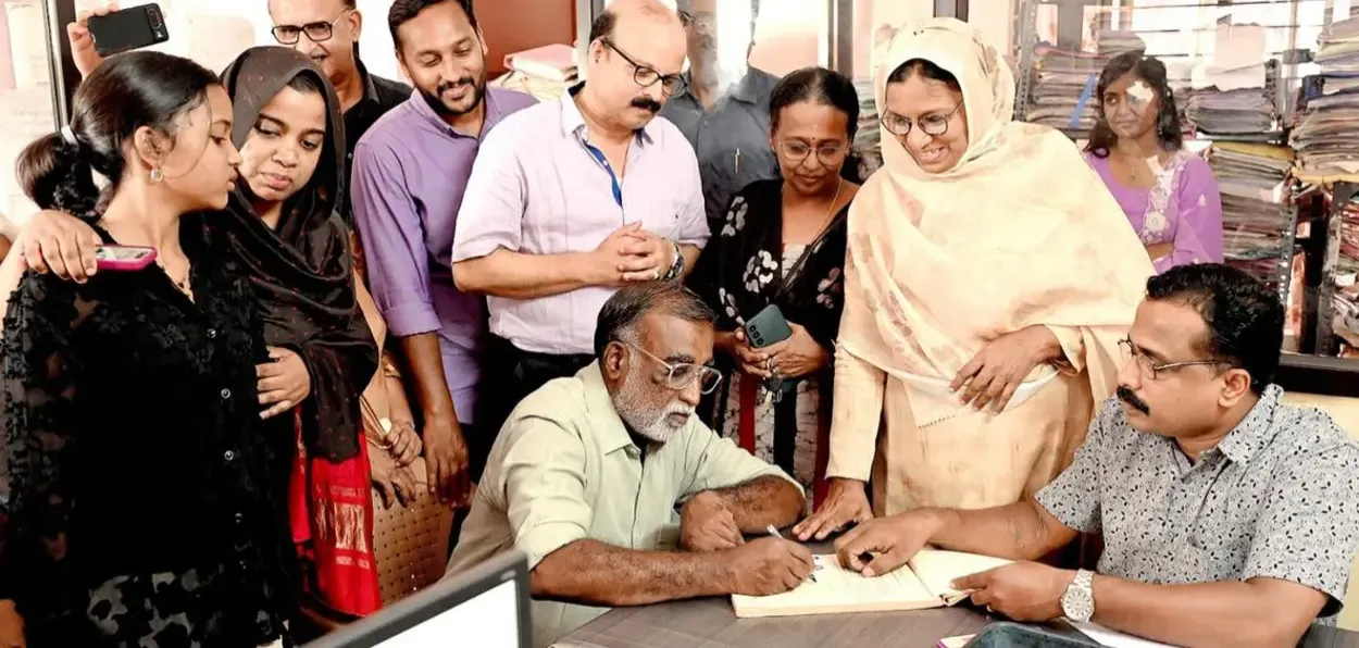 Neeju and Ismail signing papers for their marriage under Special marriage Act