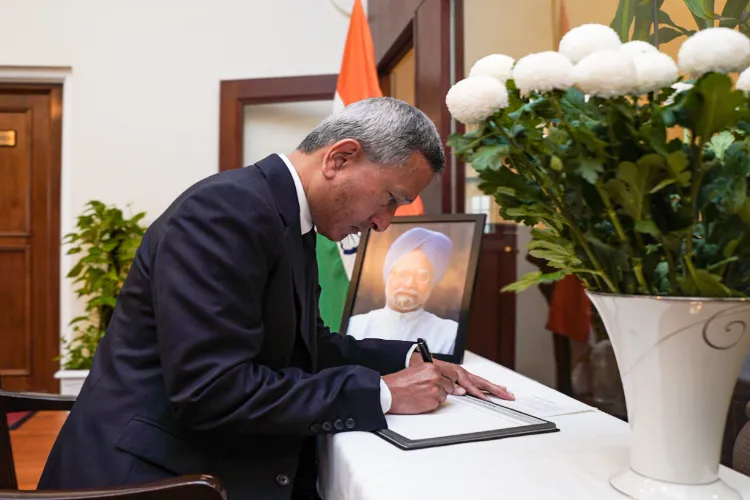 Singapore's Minister for Foreign Affairs Vivian Balakrishnan signs condolence book at Indian High Commission