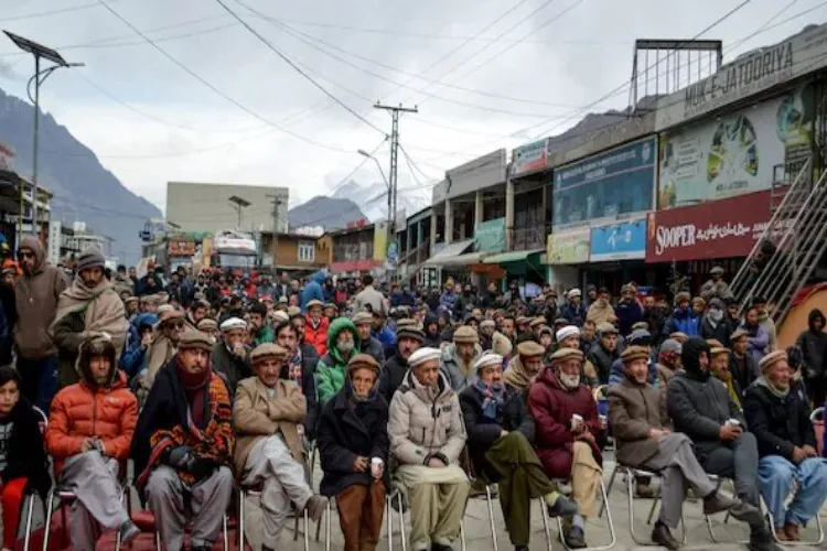 people sitting in a protest rally at some place in Gilgit-Basltistan