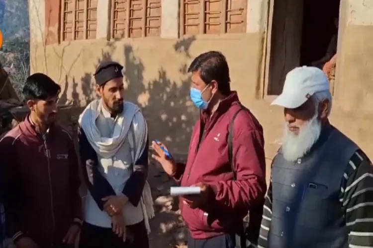 Health officials speaking with locals in Budhal village of Rajouri, J&K