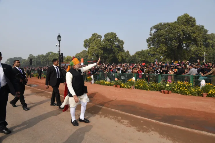 Prime Minister Narendra Modi walk down Kartavya Path to greet people at the Republic Day Parade