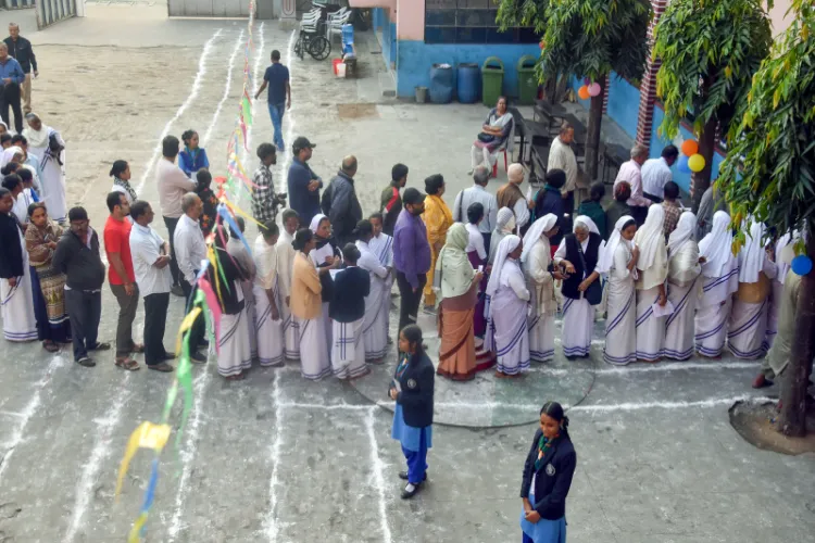 People in queue to cast their votes in Erode east