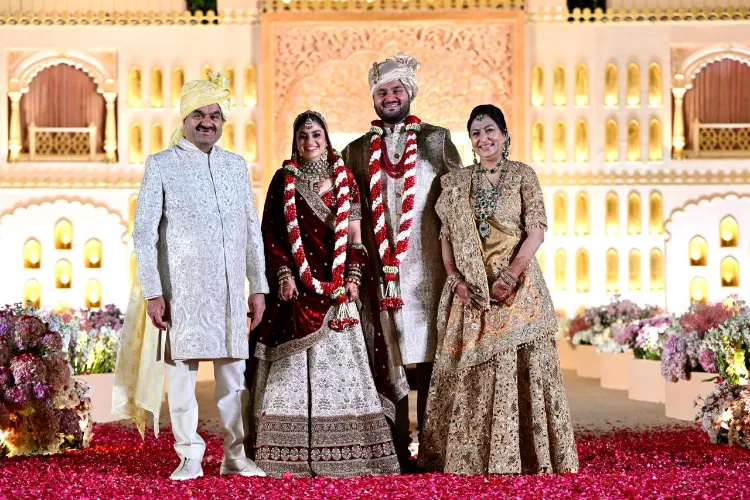 Gautam Adani and his wife with their newly wedded son Jeet and