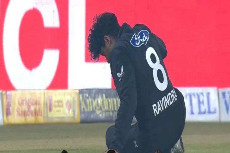 Rachin Ravindra as he falls and suffers a head injury