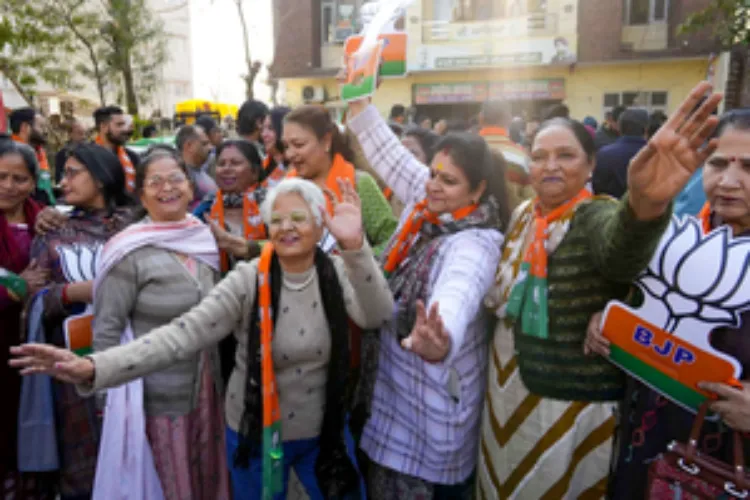 Women celebrating BJP's victory in Delhi