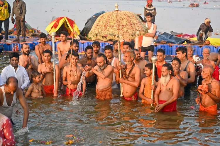 Sadhus take a holy dip, 'Amrit Snan', at Triveni Sangam