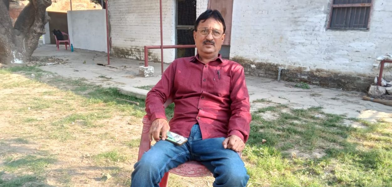 Muhammad Saleem Merchant sitting in the compound of his house in Varanasi