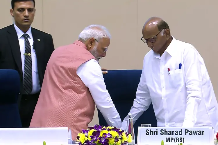 Prime Minister Narendra Modi pulls out a chair for NCP chief Sharad Pawar at the inauguration of the 98th Akhil Bharatiya Marathi Sahitya Sammelan in New Delhi on February 21