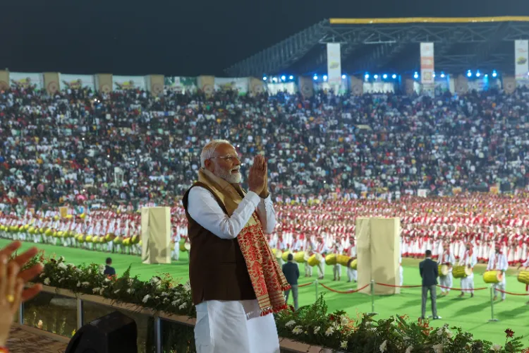 Prime Minister Narendra Modi greeting people at his civic reception in Guwahatiribbean nationsf campaigning for the second phase of Lok Sabha elections