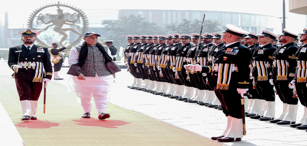 Defence Minister Rajnath Singh inspects a guard of honour ahead of the 18th Indian Coast Guard Investiture Ceremony at Bharat Mandapam in New Delhi on February 25