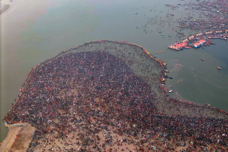 An aerial view of devotees taking a holy dip at the Triveni Sangam on the occasion of 'Maha Shivratri' during the ongoing Maha Kumbh Mela 2025 in Prayagraj on February 26, 2025