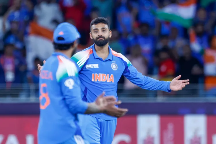 India's Varun Chakravarthy celebrates the wicket of New Zealand's Matt Henry during the ICC Champions Trophy match against India at Dubai International Stadium, in Dubai