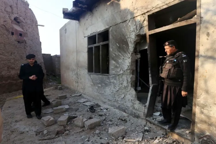 Security personnel inspect a police check-post following a terrorist attack in Pakistan's northwest Khyber Pakhtunkhwa province (File photo)