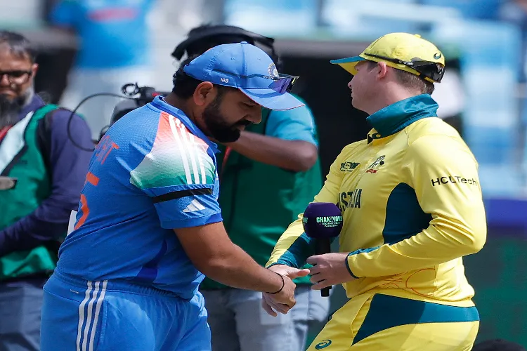 India's captain Rohit Sharma and Australia's captain Steve Smith during the toss before the start of the ICC Champions Trophy semifinal cricket match between India and Australia at Dubai International Stadium in Dubai on March 04, 2025