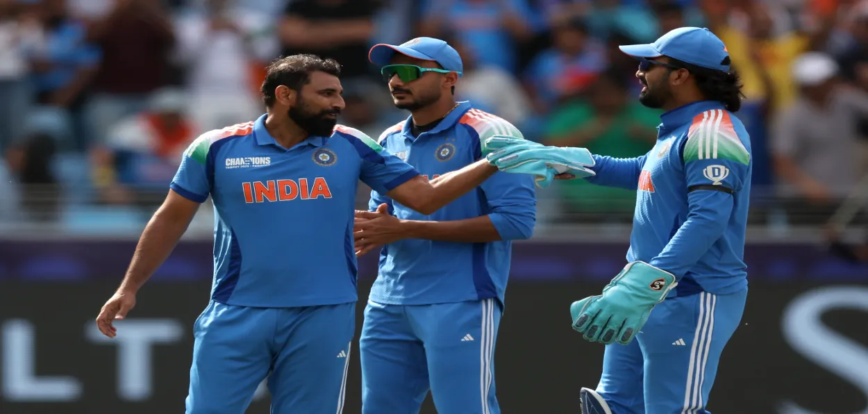 Mohammad Shami with skipper Rohit Sharma in the field during semi finals of the Champions Trophy at Dubai