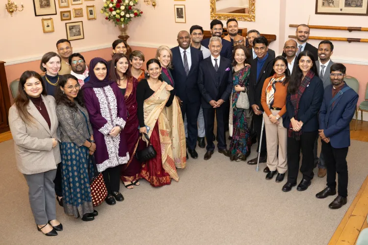 External Affairs Minister Dr S Jaishankar  and his wife pose with Chevening Scholars from India in London