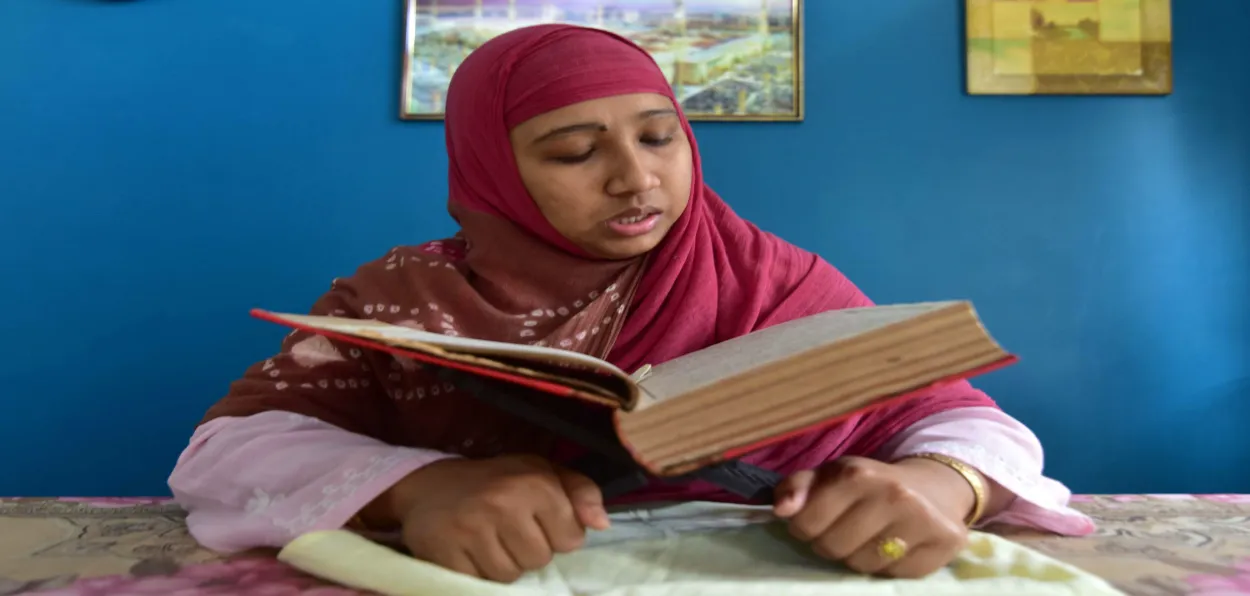 A woman reading the Holy Quran during Ramazan