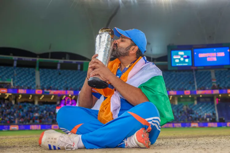 Indian captain Rohit Sharma poses with the trophy