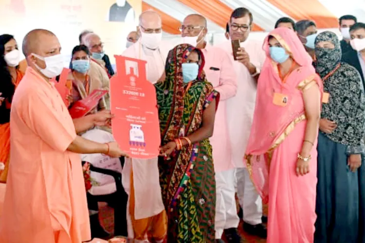 UP CM Yogi Adityanath distributes gas connections under Prime Minister Ujjawala Yojana in Mahoba on Tuesday