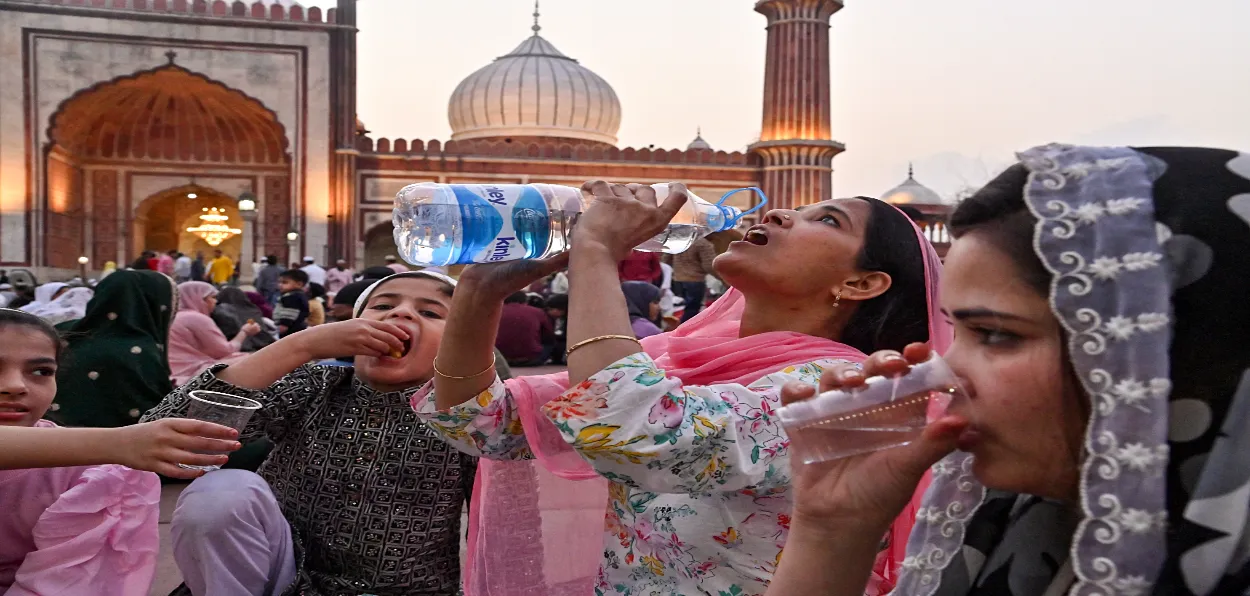 A family breaking fast during Ramzan at Delhi's Shahi Jama masjid