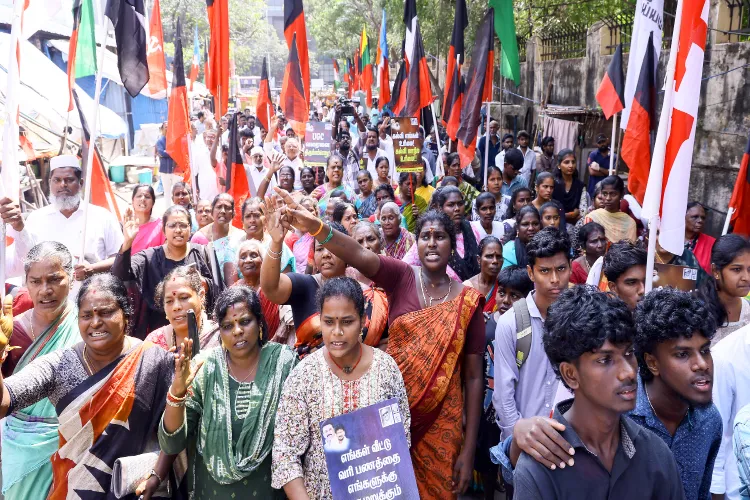 DMK supporters stage a protest against the Union Government over the alleged imposition of Hindi language in Tamil Nadu at the Collector's office in Chennai on Tuesday.