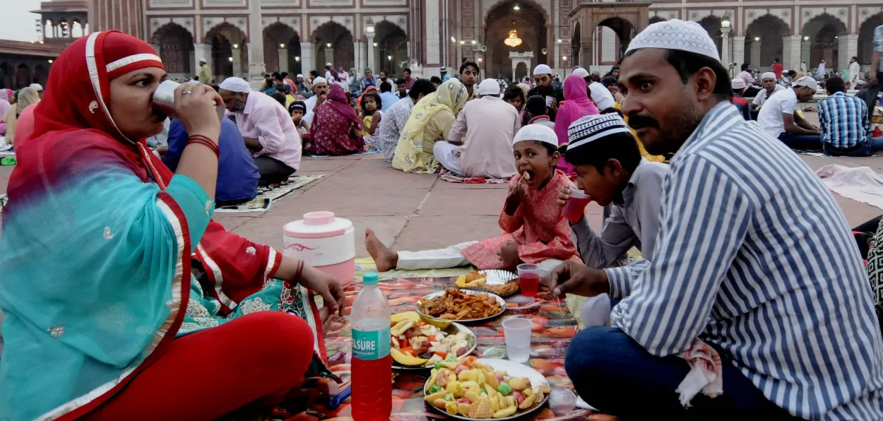 A family breaking their Ramzan fast in a mosque in Delhi 