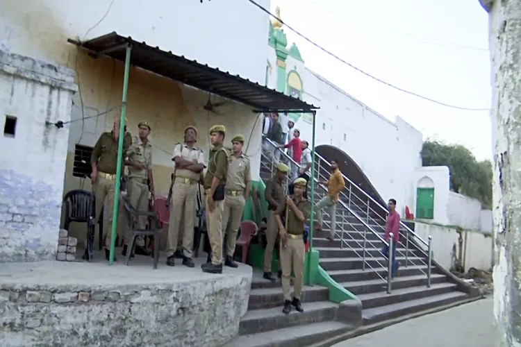 Police and paramilitary conduct a flag march in the presence of DM Rajendra Pensia and SP KK Bishnoi, ahead of Holi celebrations and Jumma Namaz, in Sambhal on Thursday. 