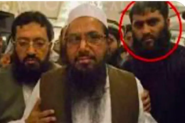 Abu Qatal, Lashkar-e-Taiba, seen behind the terror group chief Hafiz Saeed