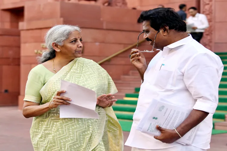 Union Minister Nirmala Sitharaman in conversation with Congress MP Kodikunnil Suresh at Parliament House during the Budget Session in New Delhi (File Photo) 